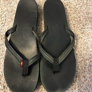 Black rainbow flip flops